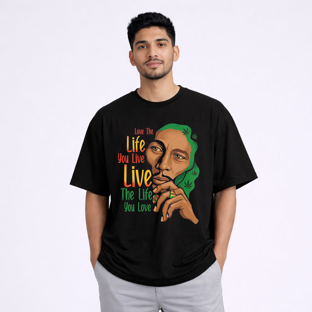 Man wearing Live The Life You Love oversized black graphic tshirt front print | Abol Tabol